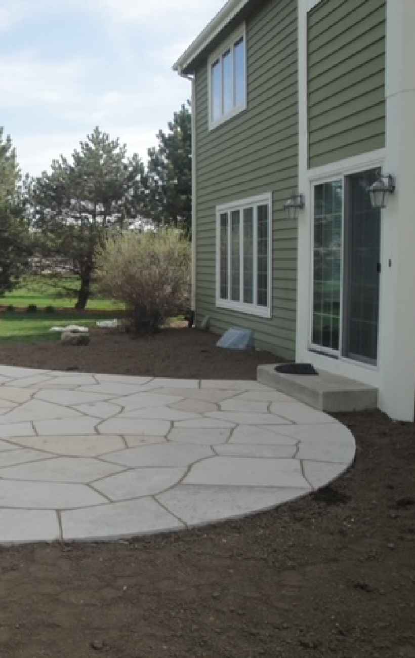 View of finished patio and fireplace.