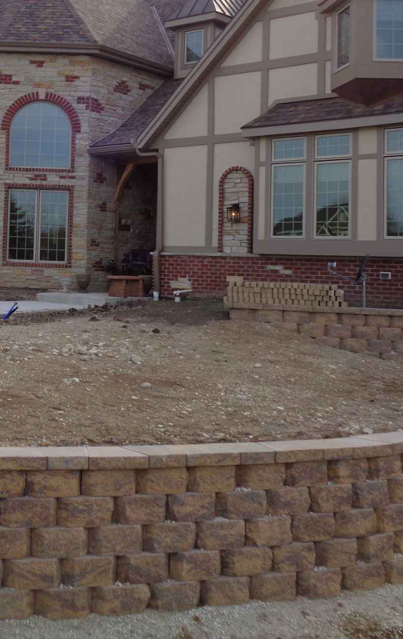 Prepping the land for gravel and stone.